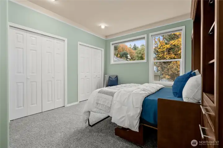 The second bedroom has two closets, lots of space, and a built-in murphy bed (included in the sale).
