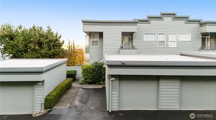 Every home has 2 deeded parking spaces. Unit 303 has this individual garage as well as the parking space to the left of that garage.