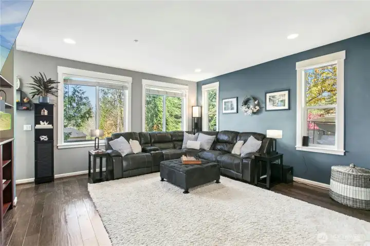 Living Room:  Bright and comfortable, this spacious living room offers the perfect place to unwind. Large windows frame the surrounding greenery, bringing the beauty of Duvall indoors. Whether enjoying a quiet evening by the fire or a movie night, this room makes every moment feel right at home.