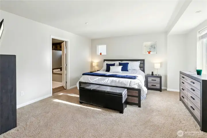 Primary Bedroom:  Bright and serene, the primary bedroom offers the perfect retreat at the end of the day. Soft natural light fills the space, complementing the clean design and generous layout. A private entry to the updated bath adds convenience and a touch of luxury.