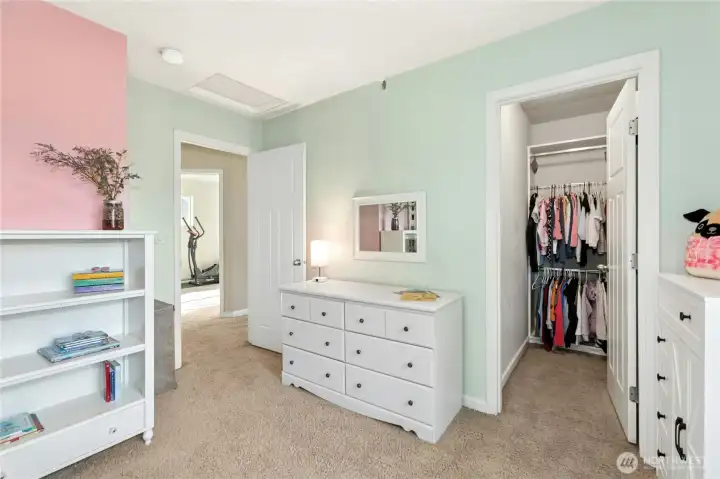 Bedroom Two (Alternate View):  Soft tones and natural light give this space an open, calming atmosphere. The room features a spacious closet and layout flexibility for rest, hobbies, or quiet productivity.