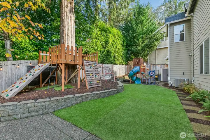 Fun and functional outdoor space with turf lawn, dual play structures, and plenty of room to relax or entertain.