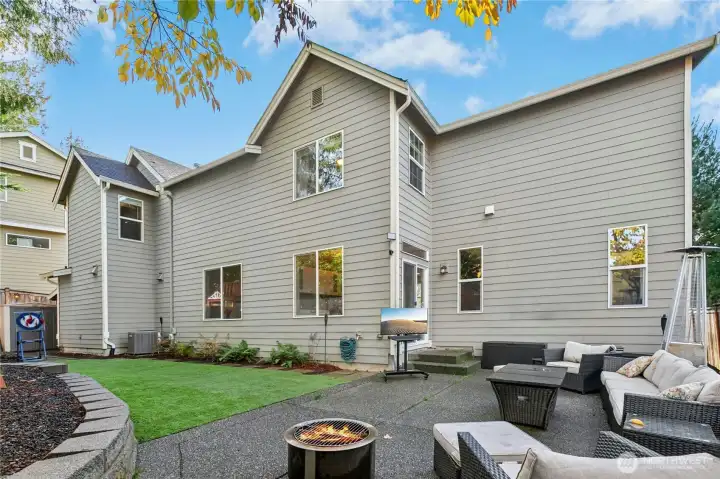 Back patio and turf lawn provide a private, low-maintenance setting ideal for relaxing, grilling, or hosting friends outdoors.