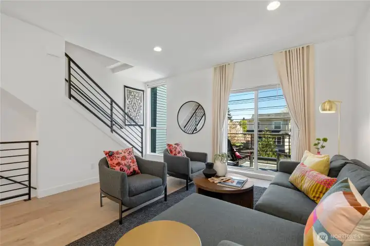 Open floor plan with outdoor space on every level and southeast-facing windows.