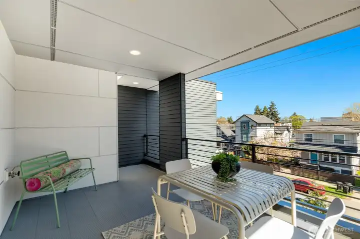 Generous covered patio off the primary bedroom.
