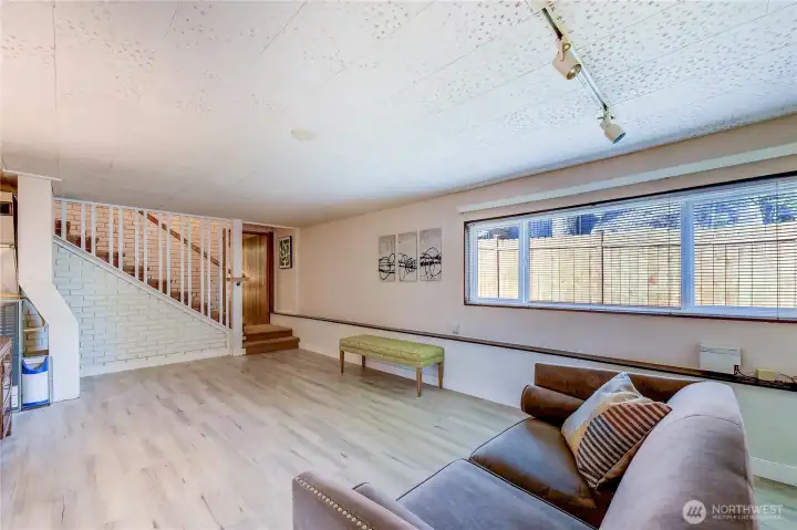 Staircase down to lower level family room.