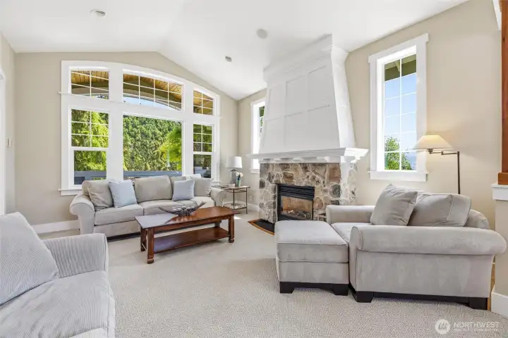 Custom millwork with rounded windows and coved trim on fireplace are just a few examples of the special details in this home