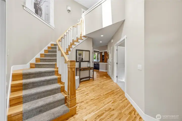 Beautifully crafted staircase leads to upper level