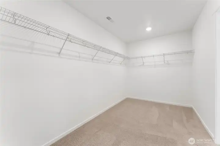 Spacious primary closet. Spacious primary closet.