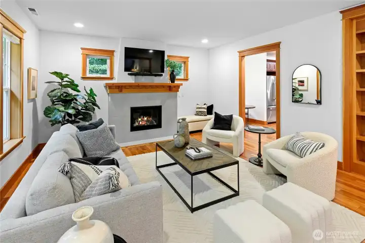 Living room features a new propane fireplace and stylish surround