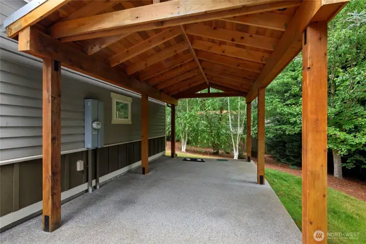 Additional covered parking in the handsome carport