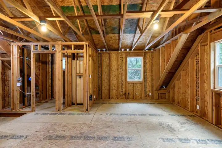Above the garage is 460 square feet of unfinished space, just awaiting your plans. It is plumbed for a 3/4 bath
