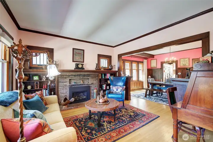 Spacious living and dining rooms. Gas fireplace surrounded by built shelving. Updated wood windows in these two rooms. Spacious living and dining rooms. Gas fireplace surrounded by built shelving. Updated wood windows in these two rooms.