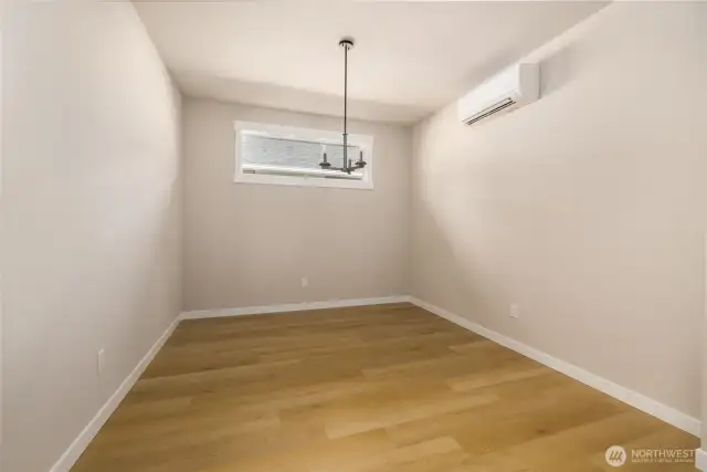 Formal dining room w/lvp flooring adjacent to the kitchen.