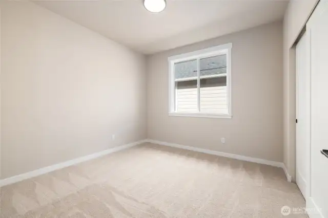 Bedroom #2 The house is built w/9' ceilings, taller windows and painted millwork to keep it light & bright.