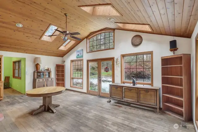 The Dining area off the kitchen can serve many functions. This opens to the patio garden and has abundant light.