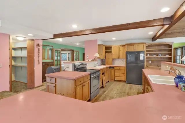 Modern kitchen in the heart of the home was functional but needs some cabinet repair.