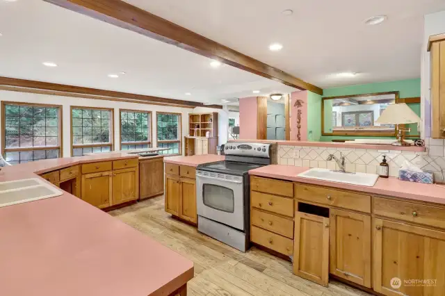 The spacious and brightly lit kitchen heart of the home.