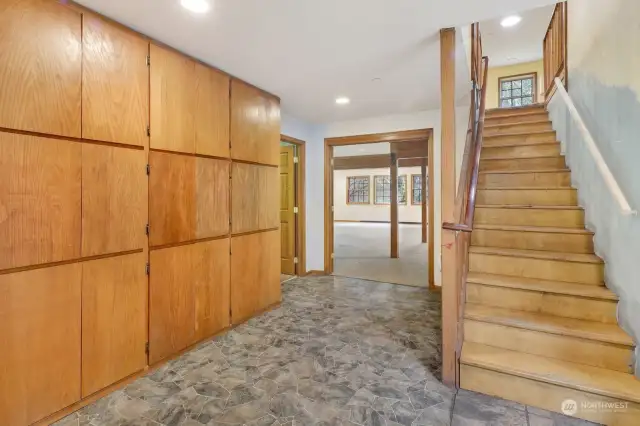 The hallway next to the kitchen provides more storage and upstairs access via quiet, sturdy stairs. Half bath is on the left just before the great room.