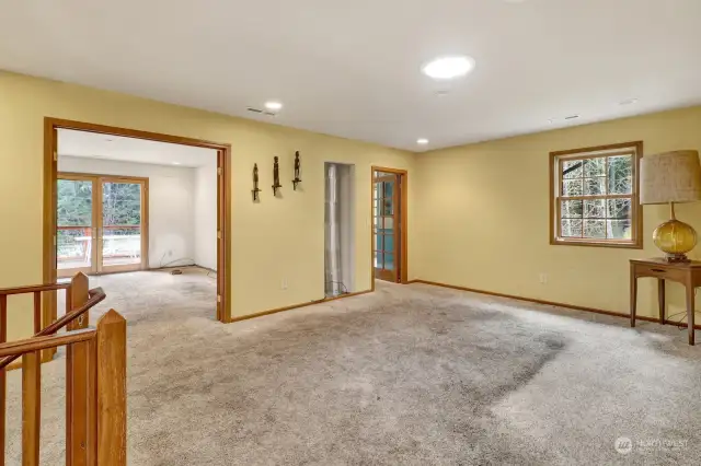 From the top of the stairs, showing office, landing room, artist's mural bedroom access.