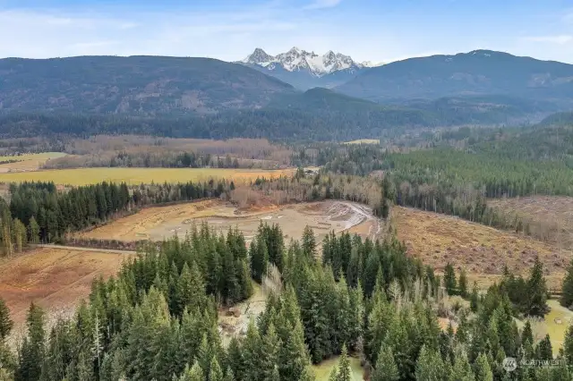 The homestead is the middle clearing surrounded by trees, shown in context of local forestry & mineral operations, convenient access to the Mt. Baker National Wilderness & recreation areas.