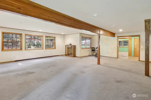 The great room looking toward the small barn, carport and entrance.