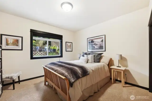 The second bedroom looks out at the beautiful terraced front yard.