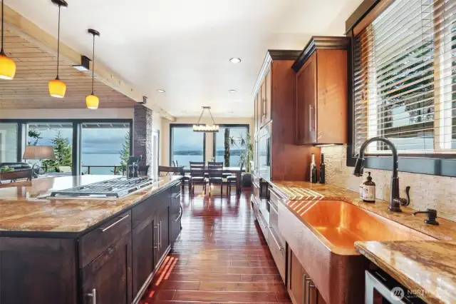 The attention to detail continues throughout the home. The kitchen has a hammered copper farm sink and granite countertops.