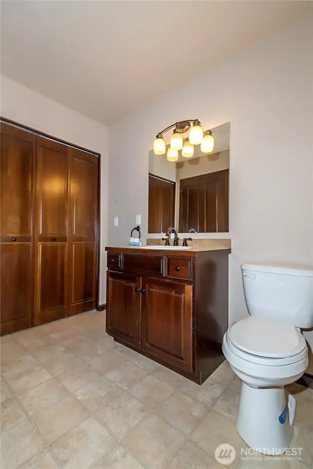 Main bathroom with W/D in the closet