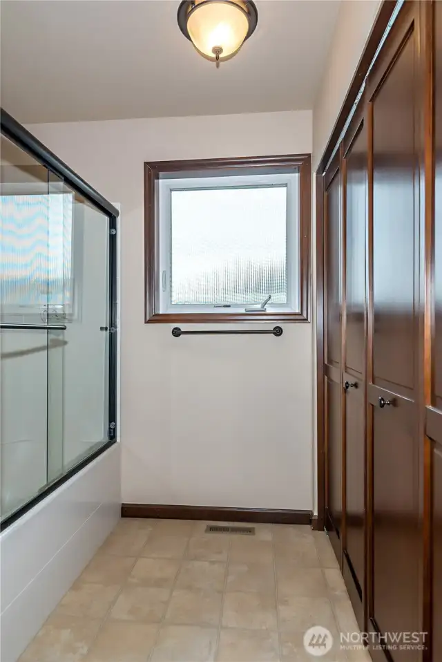 Main bathroom has crank-windows. Water softener system, furnace, and WH in closet