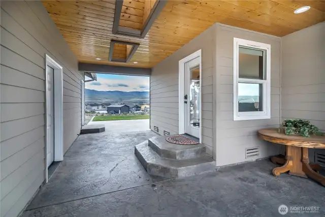 Breezeway between the house and garage with skylights and an outdoor hood for the grill