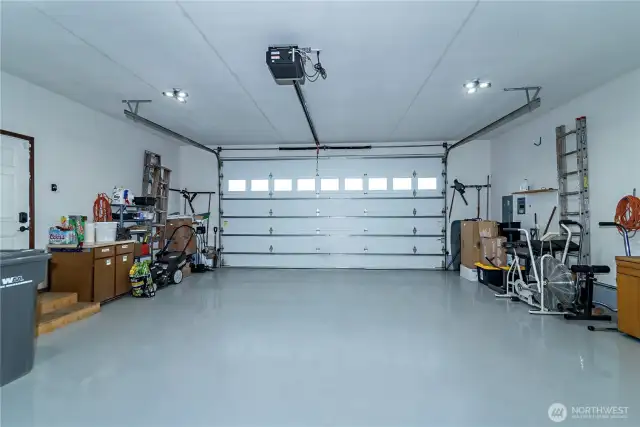 2-car garage with epoxy flooring and built-in cabinets