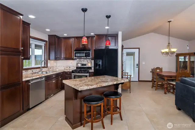 Under-cabinet lighting accentuates the granite countertops