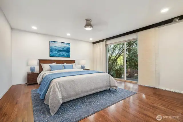 Primary bedroom is large and has slider to large deck. Create your own private oasis with potted plants.