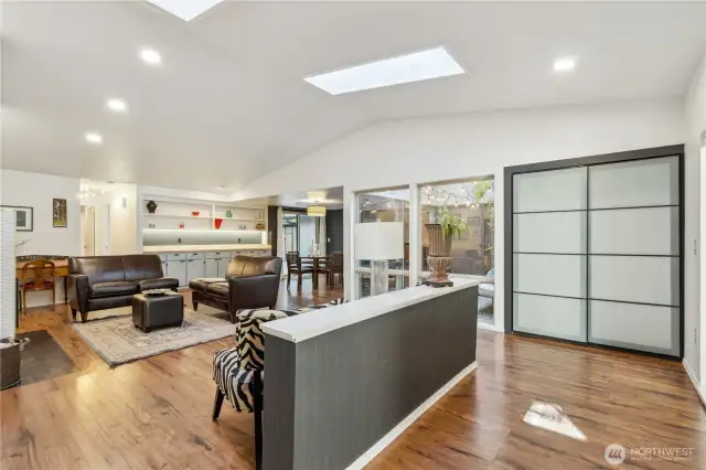 Ample guests closet with modern doors.
