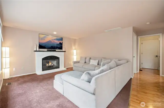 Gather around the gas fireplace in this comfortable living space, with room for oversized seating and wall-mounted TV.