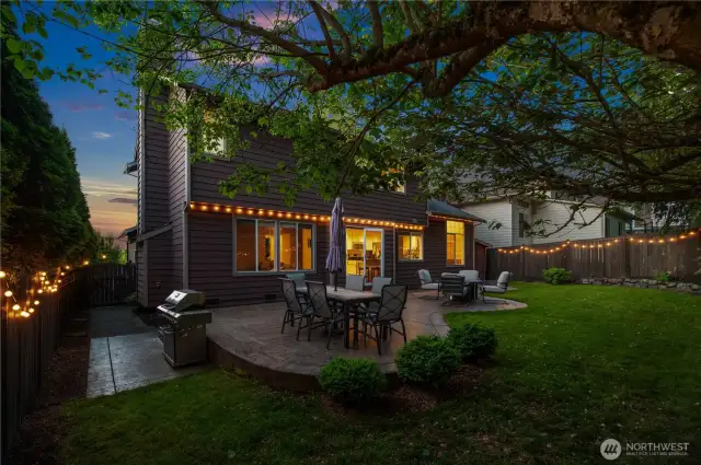 Cozy twilight ambiance with bistro lights for an inviting evening retreat.