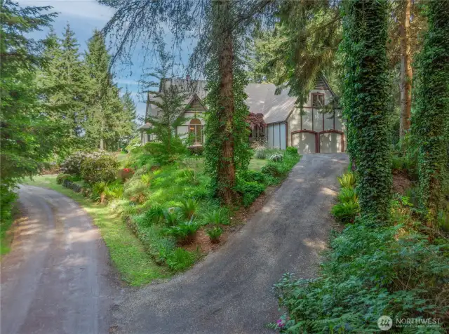 Welcome home! This gorgeous property shares a private road with just one other home. The gravel driveway was just regraded. About two-thirds of the 5 acres is forested with native trees and lush undergrowth, offering privacy and wildlife habitat.