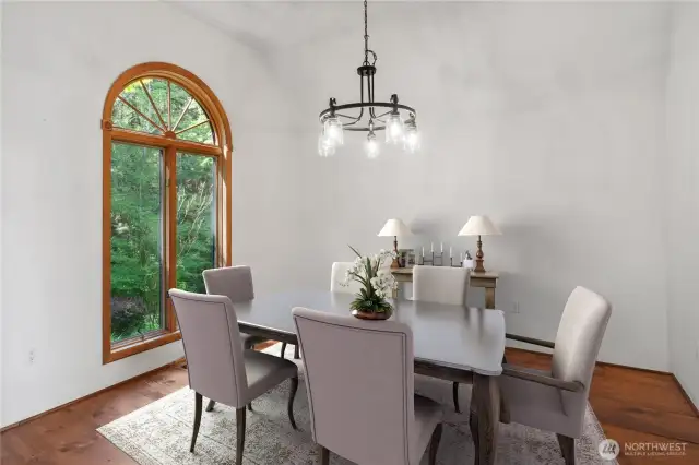 Another view of the dinng room. The use of real wood floors and window casing add a lot of charm to the home.