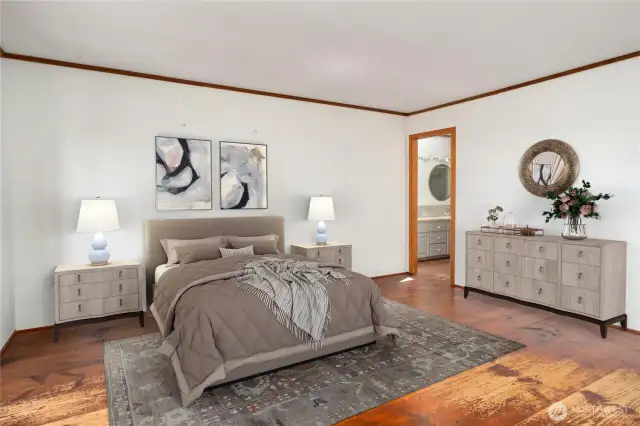 Another view of the primary ensuite on the main level. The door in the background leads to the large bathroom and walk-in closet.