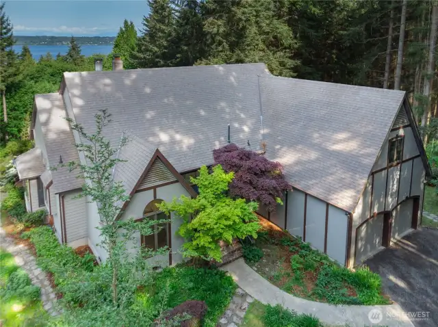 Full of character and architectural charm, this unique Tudor-style home blends the elegance of a French Tudor front with the classic appeal of traditional horizontal slat siding at the rear. Nearby state beaches offer gorgeous, sandy beaches and a boat launch!