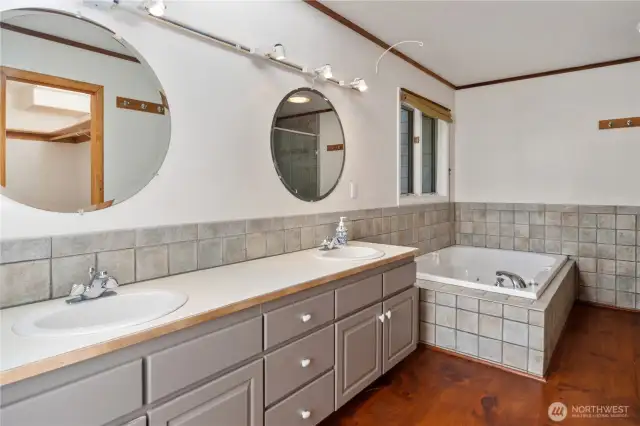 The spacious primary ensuite has dual sinks, a large soaking tub, separate shower and walk-in closet. It is ready for your updates and personal touches.