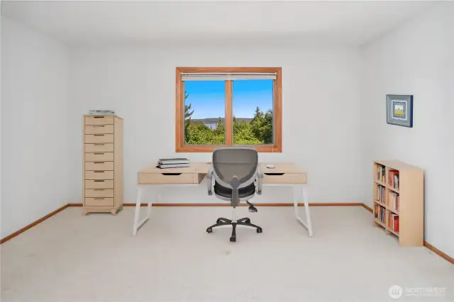 This is actually one of two upper level bedrooms. This east-facing room has distant views of the Hood Canal and Cascade mountains.