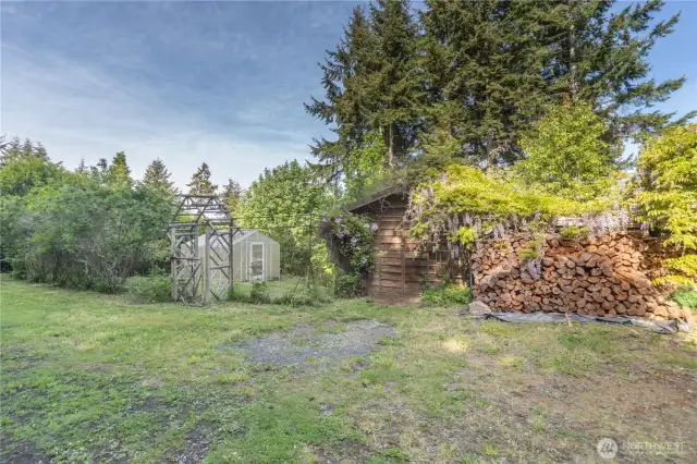 160 Bywater Way has a small fenced vegetable garden with a green house, a functional shed, and lots of wood ready for your new homes' fireplaces.