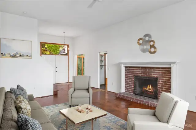 Another view of the great room and the cozy wood fireplace.