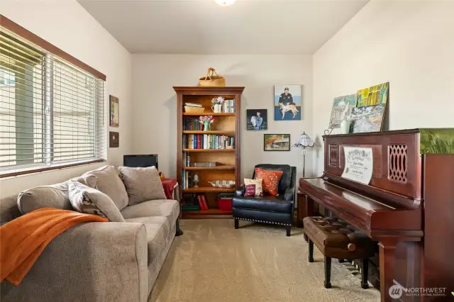 Versatile office/den with a large window!