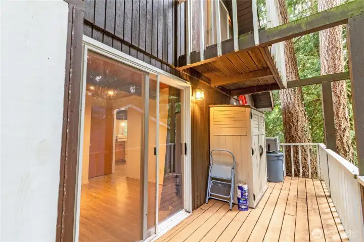 Deck off of the main floor bedroom showing the loft balcony above