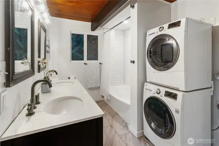 The bathroom/laundry has been updated, complete with space saving stacked washer and dryer