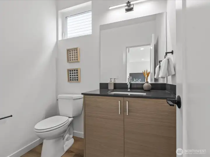 Convenient main level powder room. Similar model unit