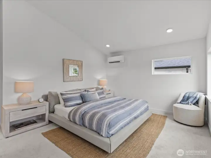 Primary with vaulted ceiling. Similar model unit